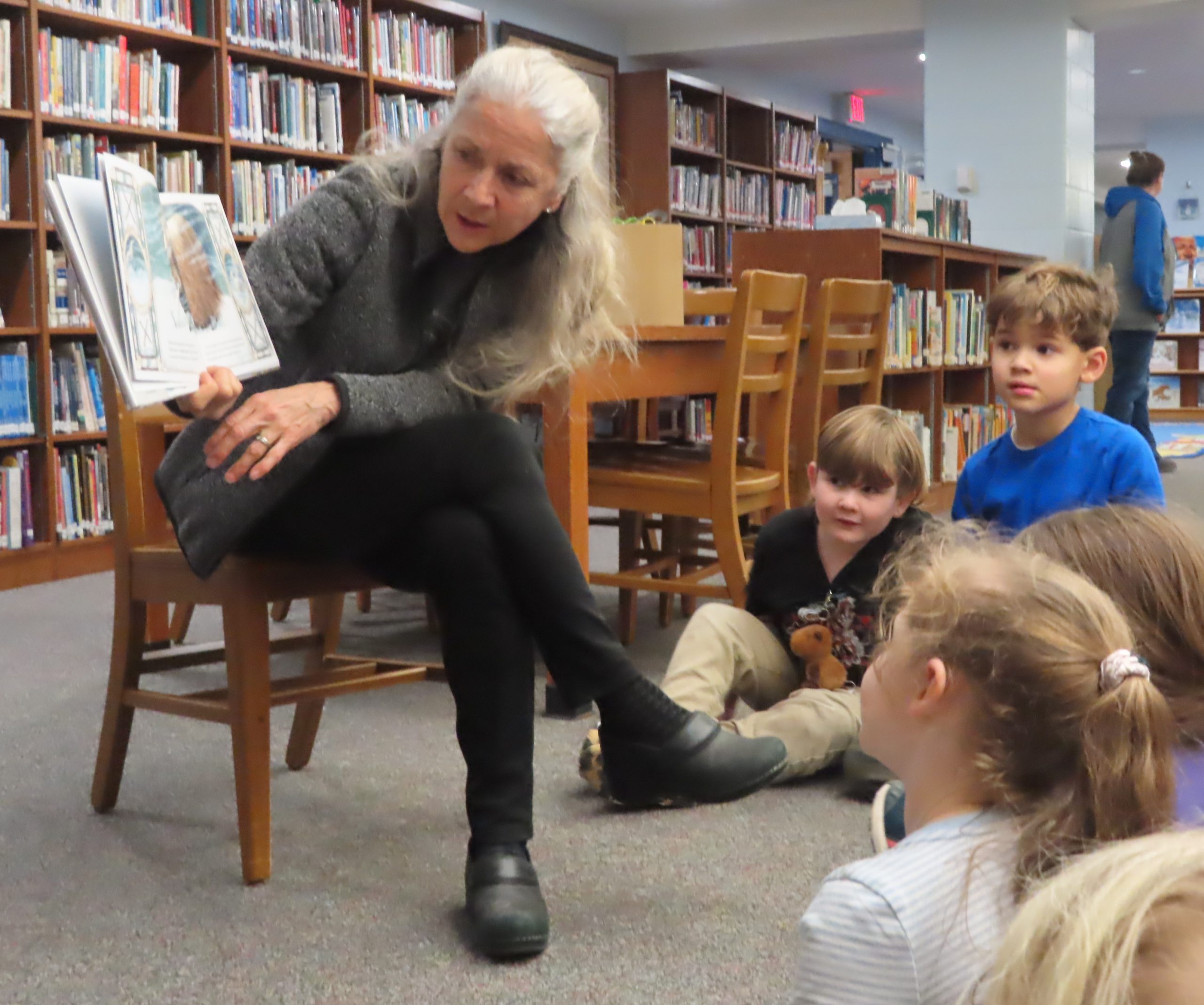 Ms. Nordyke reads a winter story to her group