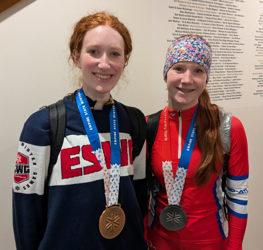 Northville skiers Lyra and Brynn Thomarie with their Empire State Winter Games medals